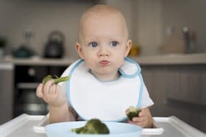baby eating food himself BLM