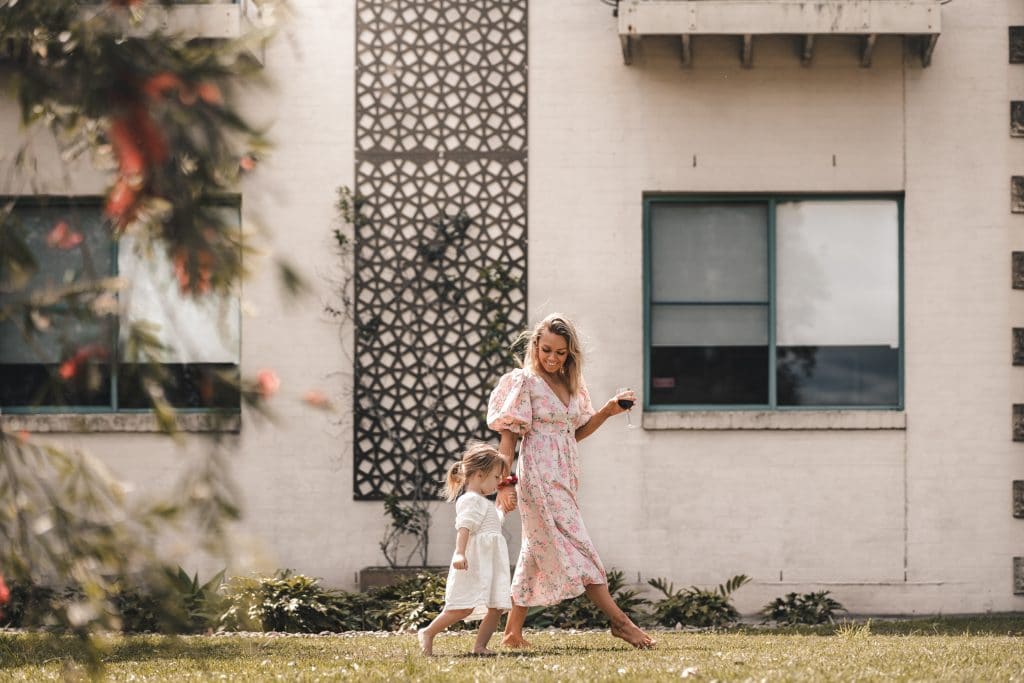 Mom with kid playing outside